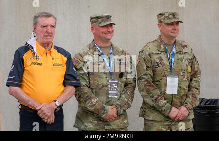 Johnny 'Lone Star JR' Rutherford III, Three-time Indy 500 Winner, poses with US Army Soldiers during the Armed Forces Weekend event at Indianapolis Motor Speedway May 21, 2022. Stock Photo