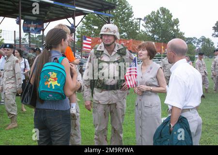 030822-A-0405B-028. US Army (USA) Major General (MGEN) MG Buford C. Blount (center), Commander, 3rd Infantry Division (ID), accompanied by his wife, visits with colleagues during a Welcome Home Ceremony at Cottrell Field, Fort Stewart, Georgia (GA), as Soldiers assigned to Headquarters and Headquarters Battalion (H&HB), 1/3 Air Defense Artillery (ADA) and 2nd Artillery 1/3 ADA, Georgia Army Reserve (AR), return Home following the Unit’s deployment to Iraq, in support of Operation IRAQI FREEDOM. Stock Photo