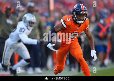 Denver Broncos wide receiver Kendall Hinton (9) runs with the ball during  the first half of an NFL football game against the Las Vegas Raiders,  Sunday, Oct. 2, 2022 in Las Vegas. (