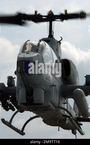 A US Marine Corps (USMC) AH-1W Super Cobra from Helicopter Marine Light Attack Squadron 773 (HMLA-773) flies over Hurlburt Field Air Force Base (AFB), Florida. Base: Hurlburt Field State: Florida (FL) Country: United States Of America (USA) Stock Photo