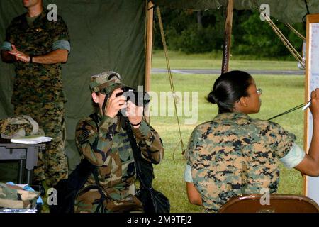 US Air Force (USAF) STAFF Sergeant (SSGT) Stacy Pearsall, Photographer, 1ST Combat Camera Squadron (CCS), photographs US Marine Corps (USMC) Sergeant (SGT) Cathy Pierre, Air Operations Non-Commissioned Officer (NCO), Marine Wing Support Squadron Two Seven Three (MWSS-273), during Exercise Eagle Vision at Marine Corps Air Station (MCAS) Beaufort, South Carolina (SC). Base: Mcas, Beaufort State: South Carolina (SC) Country: United States Of America (USA) Stock Photo