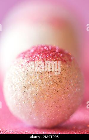 Wallpaper phone with pink glitter.background in lilac and white colors with round balls.Shiny Festive Background.soft focus. Stock Photo