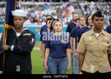 U.S. Military recruits are sworn in during halftime on Salute to Service  military appreciation day at an NFL football game between the Jacksonville  Jaguars and the Las Vegas Raiders, Sunday, Nov. 6