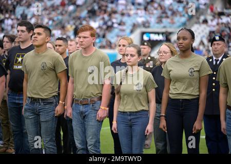 U.S. Air Force recruits are sworn in during halftime on Salute to Service  military appreciation day at an NFL football game between the Jacksonville  Jaguars and the Las Vegas Raiders, Sunday, Nov.