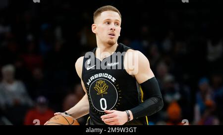 Golden State Warriors guard Donte DiVincenzo (0) handles the ball during  the second half of an NBA basketball game against the Minnesota  Timberwolves, Wednesday, Feb. 1, 2023, in Minneapolis. (AP Photo/Abbie Parr