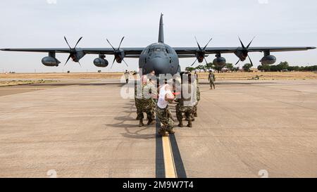 U.S. Airmen assigned to the 27th Special Operations Maintenance Group compete in a C-130 pull during Aviation Maintenance Technician day at Cannon Air Force Base, N.M., May 20, 2022. AMT day is an annual celebration that highlights the accomplishments of aviation maintenance professionals, as well as Charles Edward Taylor, who built the engine for the Wright Brothers. Stock Photo