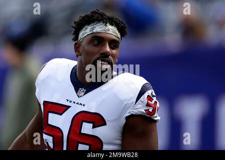 Houston Texans defensive tackle Thomas Booker IV (56) in between