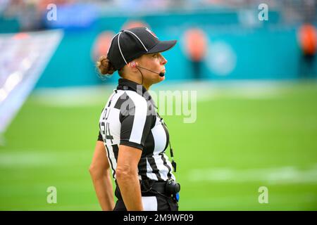 NFL back judge Robin DeLorenzo walks on the field during an NFL ...