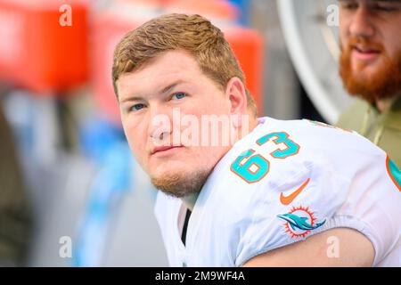 Miami Dolphins offensive lineman Michael Deiter (63) talks with Miami  Dolphins quarterback Teddy Bridgewater on the sidelines during an NFL  football game against the Houston Texans, Sunday, Nov. 27, 2022, in Miami