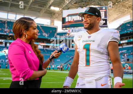 CBS Sports sideline reporter AJ Ross interviews Miami Dolphins quarterback  Tua Tagovailoa (1) on the field