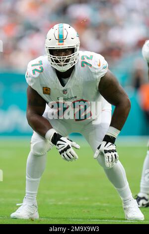 Miami Dolphins offensive tackle Terron Armstead (72) grabs quarterback Tua  Tagovailoa (1) after he was hit on a play during the first half of an NFL  football game against the Buffalo Bills