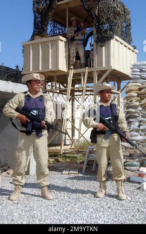 Three Royal British Army (UK) Soldiers armed with 5.56mm M16A2 rifles, assigned with the British Royal Gurkha Rifles, monitor activities around the Coalition Provisional Authority compound in Baghdad, Iraq during Operation IRAQI FREEDOM. Pictured left-to-right are Mr. Tej Bahadur, Mr. Gopal Gurung, and Mr. Chitra Bahadur Chhetri. Subject Operation/Series: IRAQI FREEDOM Base: Baghdad Country: Iraq (IRQ) Stock Photo