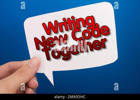 Speech bubble in front of colored background with Writing New Code Together text. Stock Photo