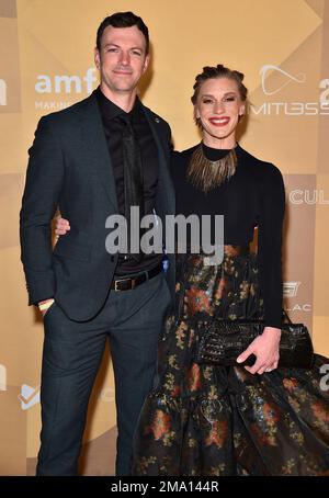 Robin Gadsby and Katee Sackhoff arrive at the amfAR Gala Los Angeles at
