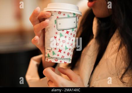 girl holding coffee cup close up Stock Photo