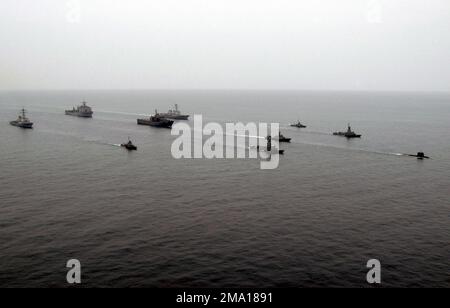 040609-N-5663H-109. [Complete] Scene Caption: A combined US and Republic of Singapore Navy (RSN) task group steams in formation at the close of the at-sea portion of the Singapore phase of COOPERATION AFLOAT READINESS AND TRAINING (CARAT). The task group consists of (from left to right): US Navy (USN) Arleigh Burke Class Guided Missile Destroyer USS RUSSELL (DDG 59); USN Whidbey Island Class Dock Landing Ship USS FORT McHENRY (LSD 43); Republic of Singapore Navy (RSN) Lurssen FPB 45 Class Fast Attack Craft Missile RSS SEA WOLF; RSN Landing Ship Tank (LST) RSS RESOLUTION; USN Arleigh Burke Clas Stock Photo