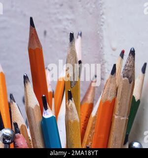 Different pencils in a jar on the table. Selective focus Stock Photo