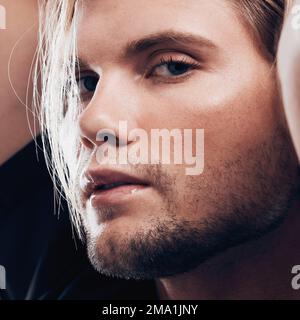 Metrosexual, stylish and portrait of attractive man with creativity, fashion and style. Makeup, cosmetics and face zoom of a serious model with beauty Stock Photo