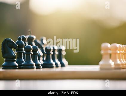 Game, smart and chess sport in nature for a challenge, strategy and brain competition in Ireland. Battle, match and board for games, strategic fun and Stock Photo