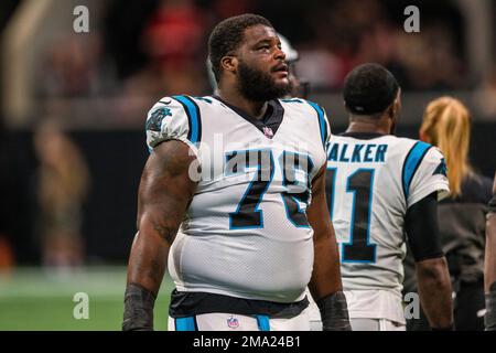 Carolina Panthers defensive tackle Marquan McCall (left) exchanges