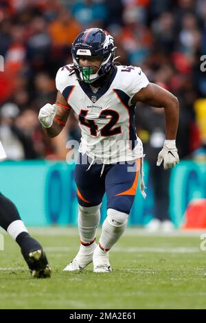 Denver Broncos linebacker Nik Bonitto runs on the field during the