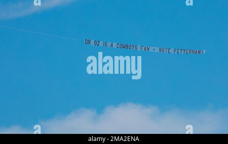 IMAGE DISTRIBUTED FOR MAKE THE ROAD ACTION - A banner reading Dr. Oz is a  Yankees Fan - Vote Fetterman is seen flying over Citizens Bank Park before  the start of the