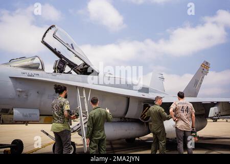 U.S. Marines with Marine Fighter Attack Squadron 323, 3rd Marine Aircraft Wing (MAW), are visited by San Diego Padres pitchers, Sean Manaea and Joe Musgrove, on Marine Corps Air Station Miramar, California, May 23, 2022. Manaea and Musgrove were able to operate the F/A-18 Hornet aircraft simulator, learn about aircraft equipment and flight operations, and meet with 3rd MAW Marines. Stock Photo