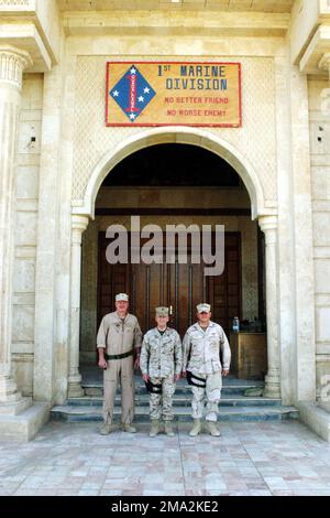 040731-M-4419R-062. [Complete] Scene Caption: US Navy (USN) Rear Admiral (RDML) (lower half) Kenneth W. Deutch (left), Commander, Combined Task Force (CTF) 57, US Marine Corps (USMC) Major General (MGEN) James N. Mattis (center), Commander, 1ST Marine Division (MAR DIV), and USN Rear Admiral (RADM) (upper half) Charles R. Kubic (right), Commander, Naval Construction Forces Command (NCFC), and Commander, Construction Group (CNSTR GP), 1ST Marine Expeditionary Force (1 MEF), 1ST Marine Division (MAR DIV), take a moment to have their photograph taken inside the 1ST MAR DIV Headquarters (HQ) build Stock Photo