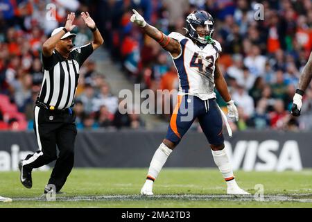 Denver Broncos linebacker Nik Bonitto walks off the field after a preseason  NFL football game against the Buffalo Bills in Orchard Park, N.Y.,  Saturday, Aug. 20, 2022. (AP Photo/Adrian Kraus Stock Photo 