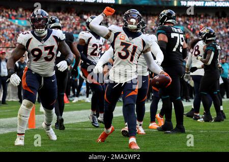 Denver Broncos players react during the NFL football game between