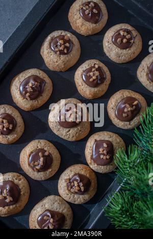 sweet home made chocolate christmas cookies on a christmas table Stock Photo