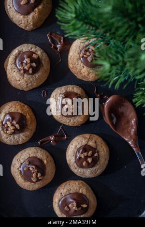 sweet home made chocolate christmas cookies on a christmas table Stock Photo