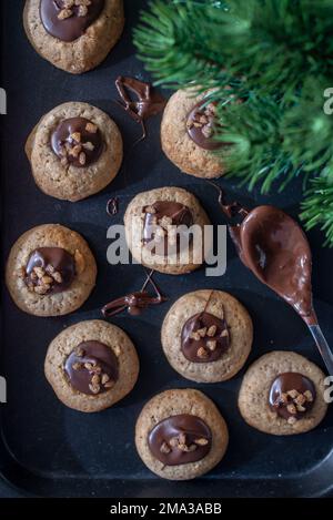 sweet home made chocolate christmas cookies on a christmas table Stock Photo