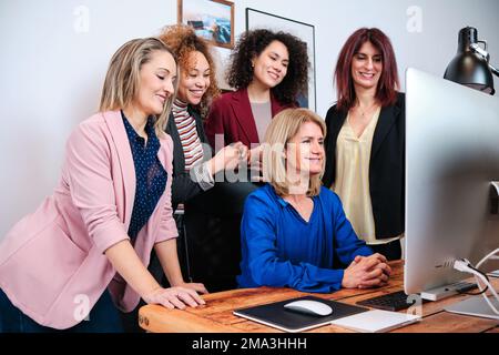 Business colleagues having an online meeting while working together in the office. Stock Photo