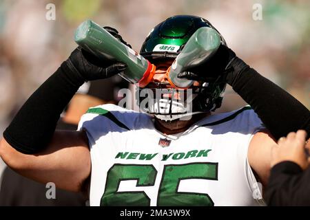 New York Jets guard Nate Herbig (71) walks off the field after an