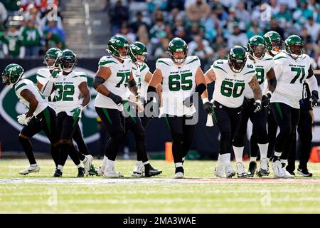 New York Jets guard Nate Herbig (65) walks to the line of scrimmage against  the New England Patriots during an NFL football game Sunday, Oct. 30, 2022,  in East Rutherford, N.J. (AP