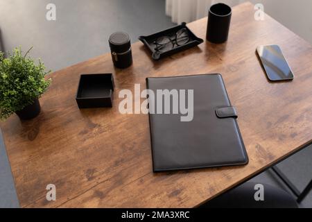 leather folder for documents on the desktop in the office Stock Photo