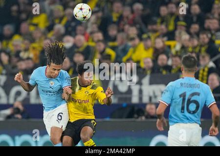 Manchester City's Nathan Aké, left, and Bayern Munich's Thomas Müller go  after the ball during the first half of a friendly soccer match Saturday,  July 23, 2022, at Lambeau Field in Green