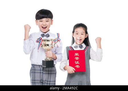 Happy pupils with a trophy and certificate Stock Photo