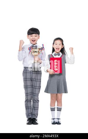 Happy pupils with a trophy and certificate Stock Photo