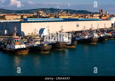 Pilot boats are fixed in the industrial Port of Livorno, Porto di Livorno, one of the largest seaports in the Mediterranean Sea. Stock Photo