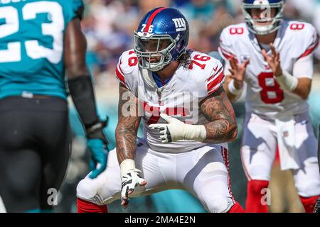 New York Giants guard Jon Feliciano (76) takes the field to face the  Washington Commanders during an NFL football game Sunday, Dec. 4, 2022, in  East Rutherford, N.J. (AP Photo/Adam Hunger Stock