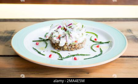 Calamari ceviche. The cebiche or ceviche is a dish consisting of fish marinated in citrus seasonings. Stock Photo