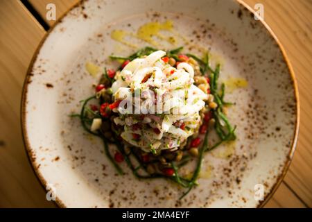 Calamari ceviche. The cebiche or ceviche is a dish consisting of fish marinated in citrus seasonings. Stock Photo