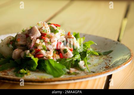 Calamari ceviche. The cebiche or ceviche is a dish consisting of fish marinated in citrus seasonings. Stock Photo