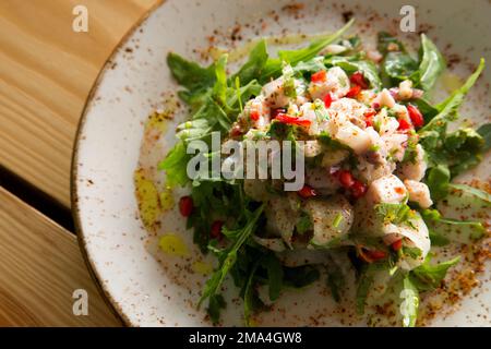 Calamari ceviche. The cebiche or ceviche is a dish consisting of fish marinated in citrus seasonings. Stock Photo