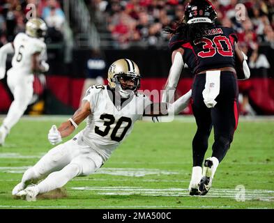 New Orleans, Louisiana, December 18, 2022. New Orleans Saints safety Justin  Evans (30) forces Atlanta Falcons wide receiver Drake London (5) into  fumbling the ball on a game-saving fourth down play late