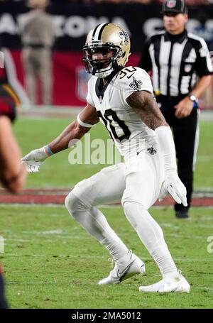 New Orleans, Louisiana, December 18, 2022. New Orleans Saints safety Justin  Evans (30) forces Atlanta Falcons wide receiver Drake London (5) into  fumbling the ball on a game-saving fourth down play late