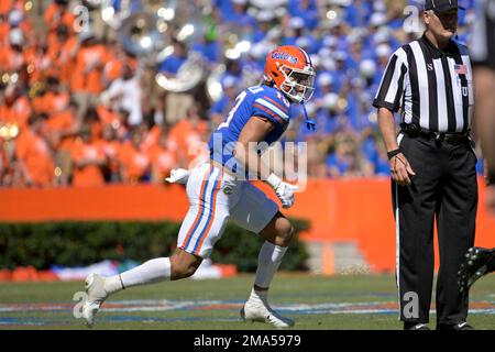 Florida safety Donovan McMillon (13) defends against Eastern Washington  wide receiver Efton Chism III (89) during the second half of an NCAA  college football game, Sunday, Oct. 2, 2022, in Gainesville, Fla. (