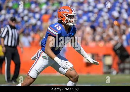 Florida safety Donovan McMillon (13) defends against Eastern Washington  wide receiver Efton Chism III (89) during the second half of an NCAA  college football game, Sunday, Oct. 2, 2022, in Gainesville, Fla. (